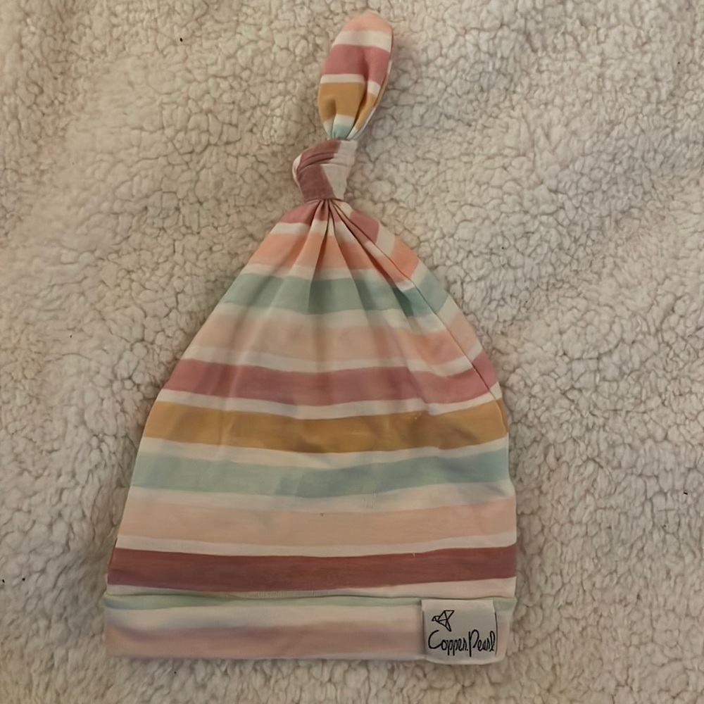 Copper pearl top knot hat